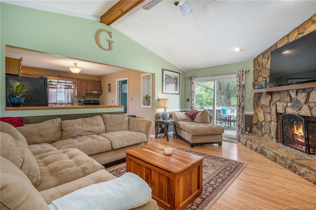 1714 East Sandy Ridge Road Monroe, NC 28112 - Photo 7 of 28 a living room with furniture and a flat screen tv