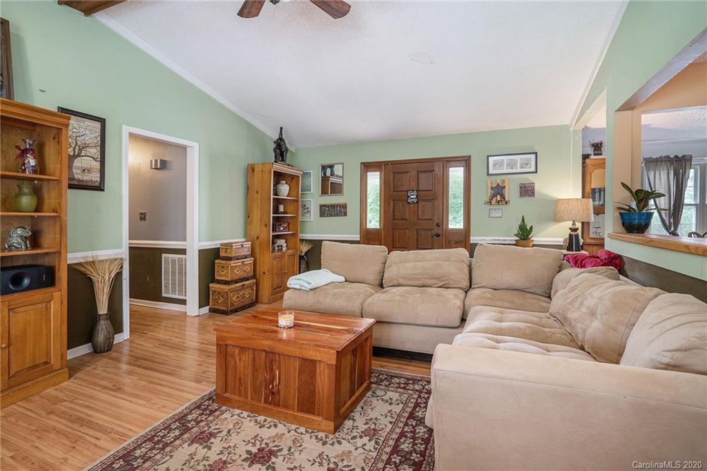 1714 East Sandy Ridge Road Monroe, NC 28112 - Photo 8 of 28 a living room with furniture and wooden floor