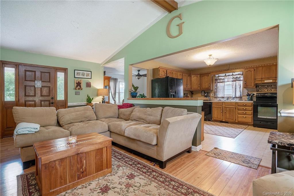 1714 East Sandy Ridge Road Monroe, NC 28112 - Photo 9 of 28 a living room with furniture and a large window