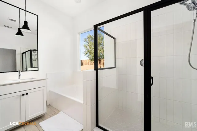 a bathroom with a bathtub and a shower