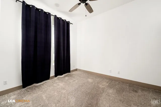 a view of a closet with wooden floor