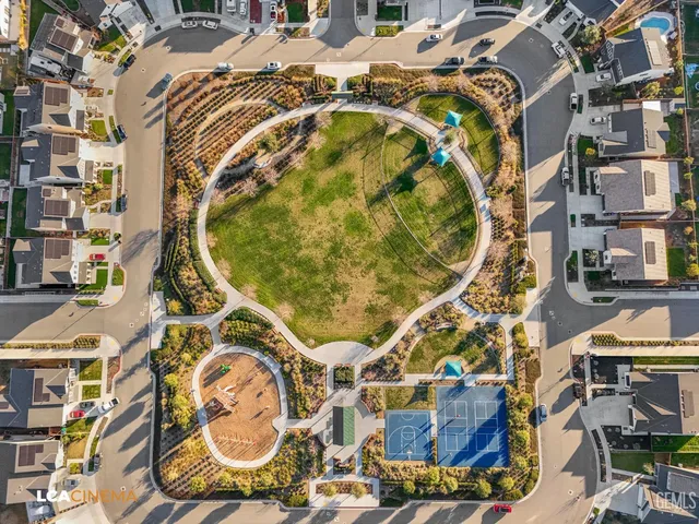 an aerial view of residential house with outdoor space and swimming pool