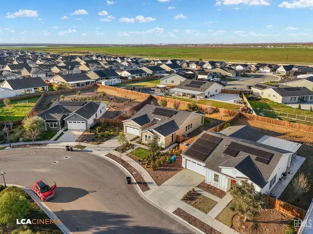 an aerial view of residential building and ocean