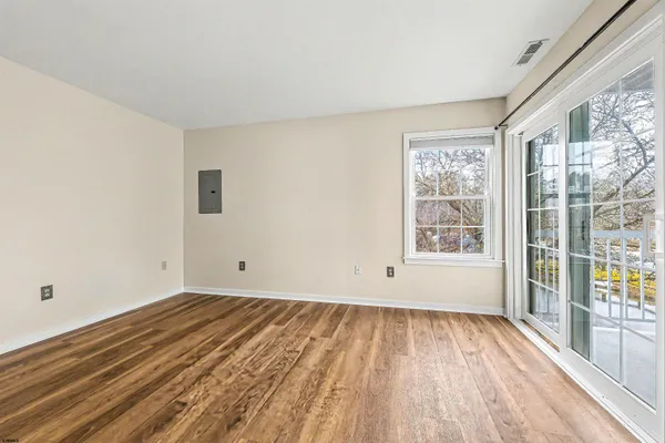 a view of a room with wooden floor and walls