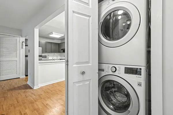 a view of a storage and utility room with washer and dryer