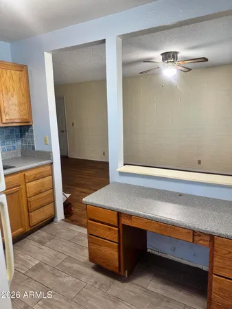 a bathroom with a glass shower door and a shower