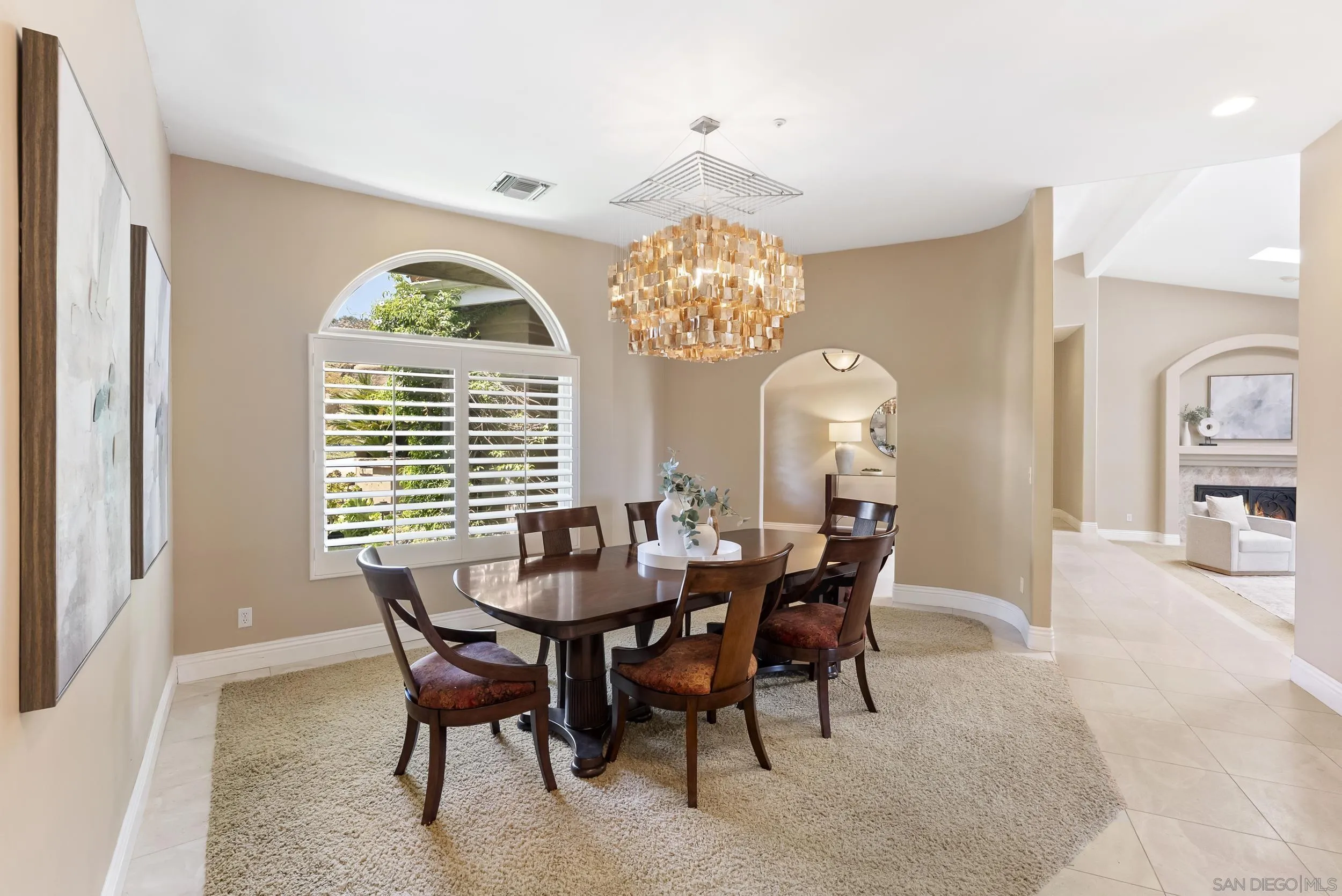 14998 Budwin Lane Poway, CA 92064 - Photo 15 of 44 a view of a dining room with furniture and a chandelier