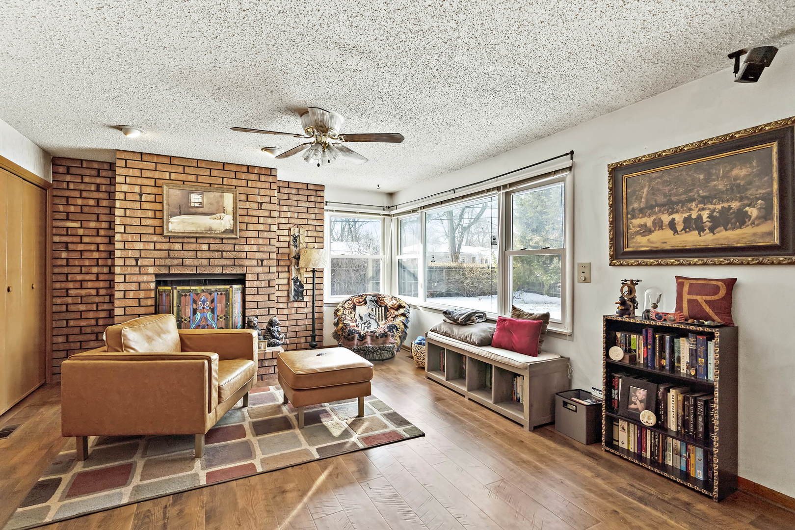 9 Strasma S Drive Kankakee, IL 60901 - Photo 11 of 16 a living room with furniture a bookshelf and a window