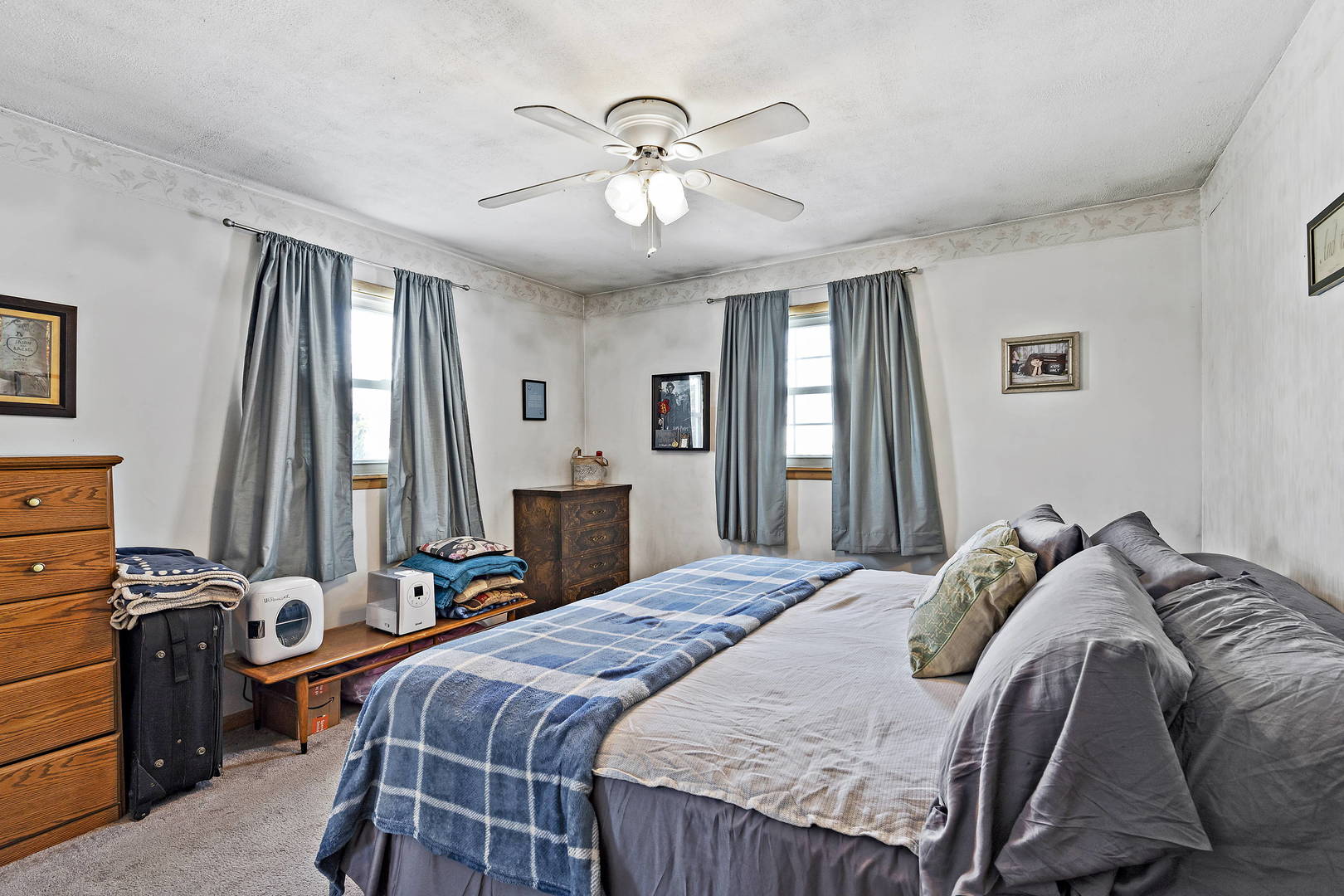 9 Strasma S Drive Kankakee, IL 60901 - Photo 14 of 16 a bedroom with a bed and a chandelier