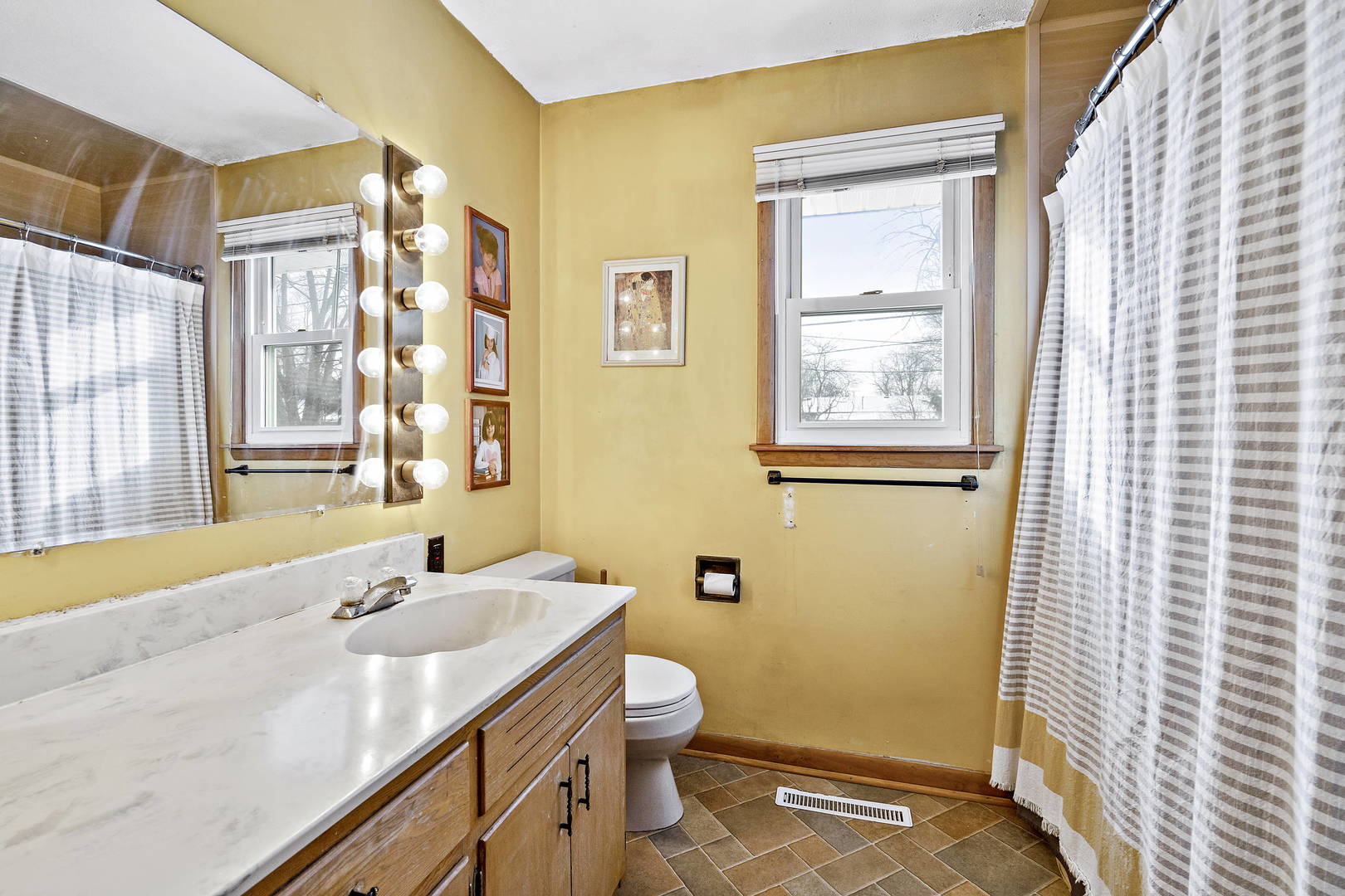 9 Strasma S Drive Kankakee, IL 60901 - Photo 6 of 16 a bathroom with a sink a toilet and shower