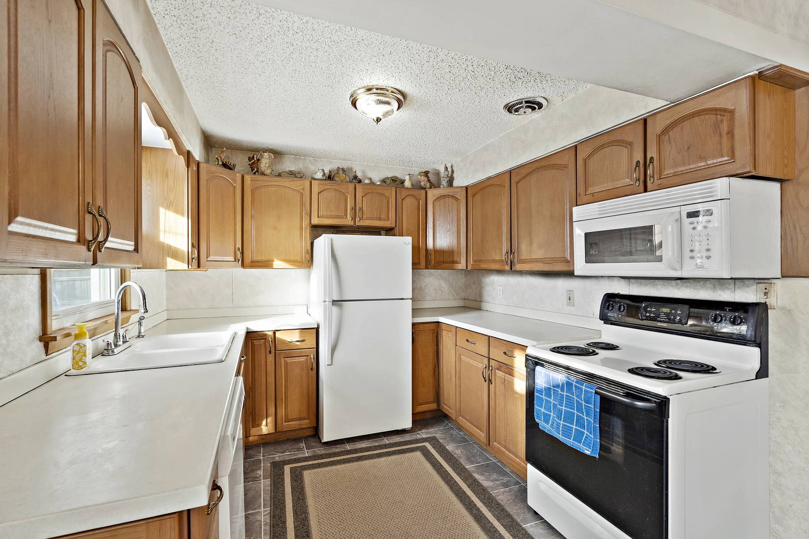 9 Strasma S Drive Kankakee, IL 60901 - Photo 7 of 16 a kitchen with stainless steel appliances a refrigerator a stove a sink and a cabinets
