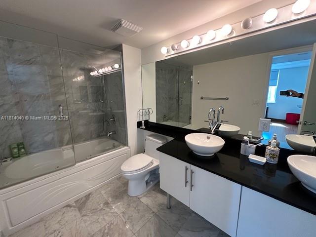 31 Southeast 5th Street, Unit 1908 Miami, FL 33131 - Photo 15 of 43 a bathroom with a double vanity sink toilet and shower