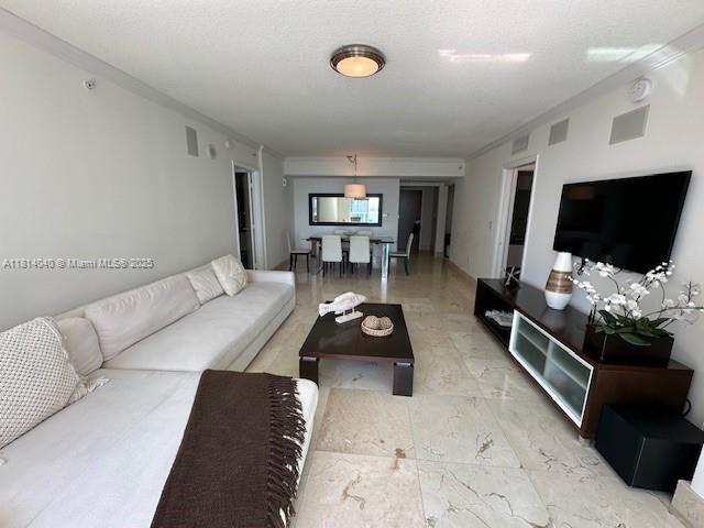 31 Southeast 5th Street, Unit 1908 Miami, FL 33131 - Photo 19 of 43 a living room with furniture and a flat screen tv