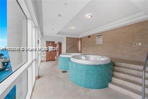 31 Southeast 5th Street, Unit 1908 Miami, FL 33131 - Photo 38 of 43 a view of a living room and kitchen