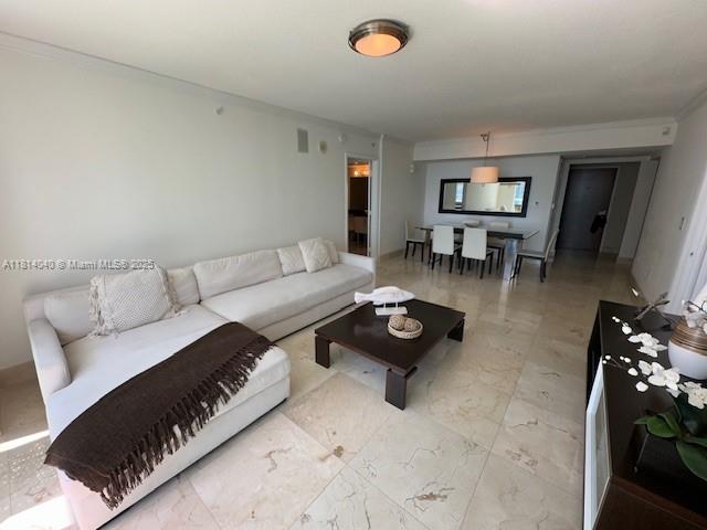 31 Southeast 5th Street, Unit 1908 Miami, FL 33131 - Photo 5 of 43 a living room with furniture and a table