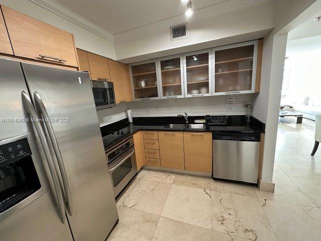 31 Southeast 5th Street, Unit 1908 Miami, FL 33131 - Photo 10 of 43 a kitchen with a refrigerator and a sink