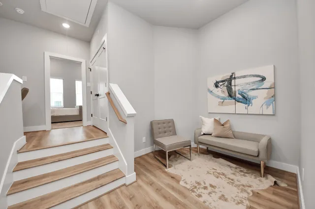 a living room with furniture and a rug