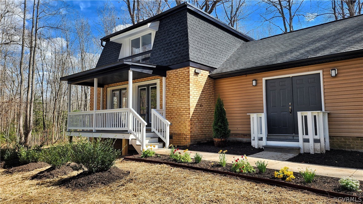 741 Waltons Store Road Louisa, VA 23093 - Photo 1 of 42 a front view of a house with a yard
