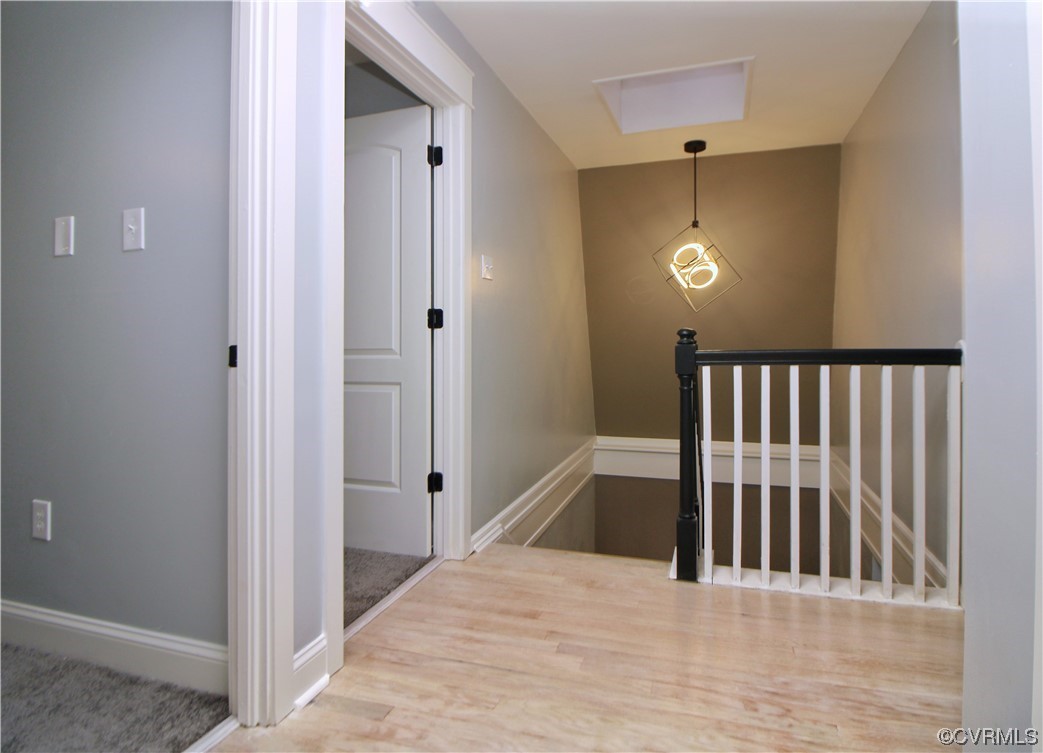 741 Waltons Store Road Louisa, VA 23093 - Photo 17 of 42 a view of a hallway with wooden floor and staircase