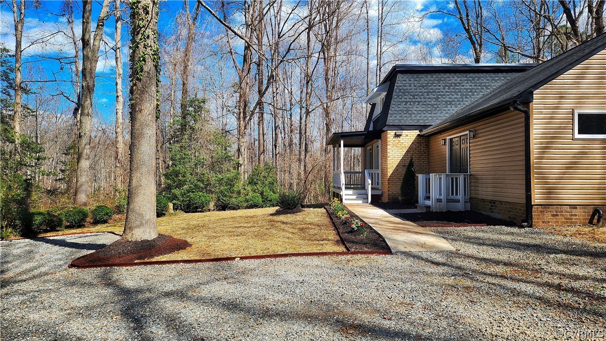 741 Waltons Store Road Louisa, VA 23093 - Photo 2 of 42 a view of a house with a tree in the background