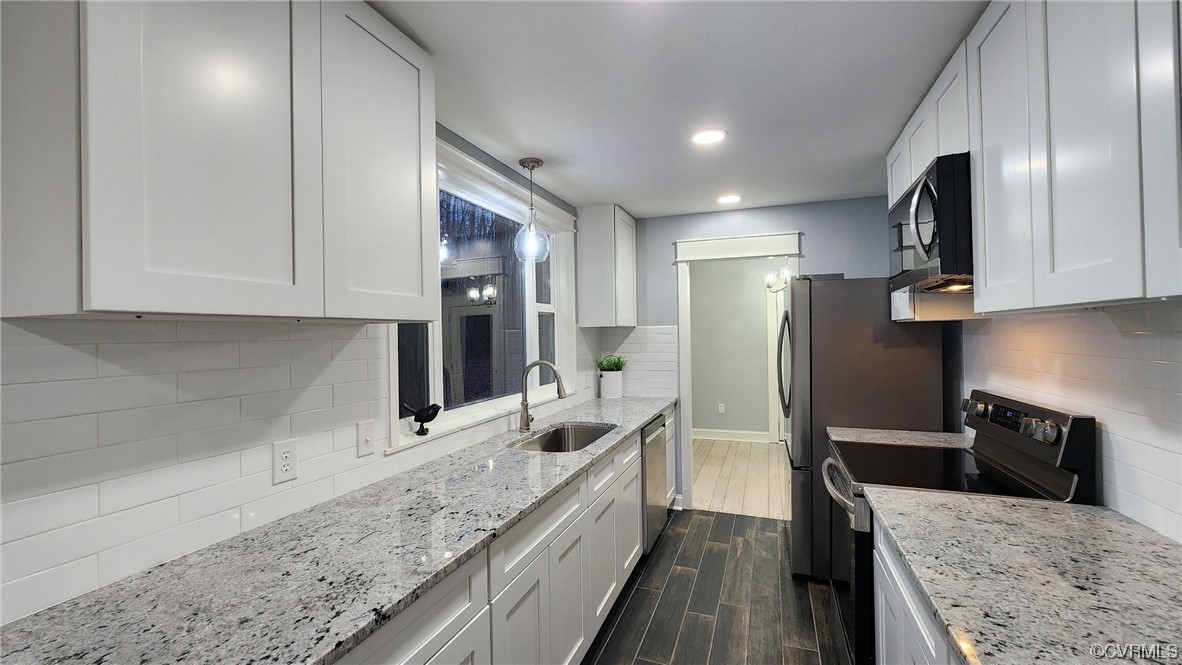 741 Waltons Store Road Louisa, VA 23093 - Photo 5 of 42 a kitchen with stainless steel appliances granite countertop a sink refrigerator and microwave