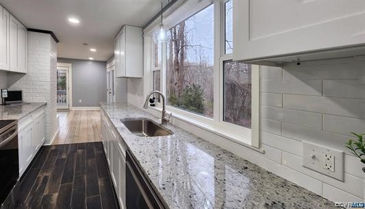 741 Waltons Store Road Louisa, VA 23093 - Photo 6 of 42 a kitchen with granite countertop a stove and a sink