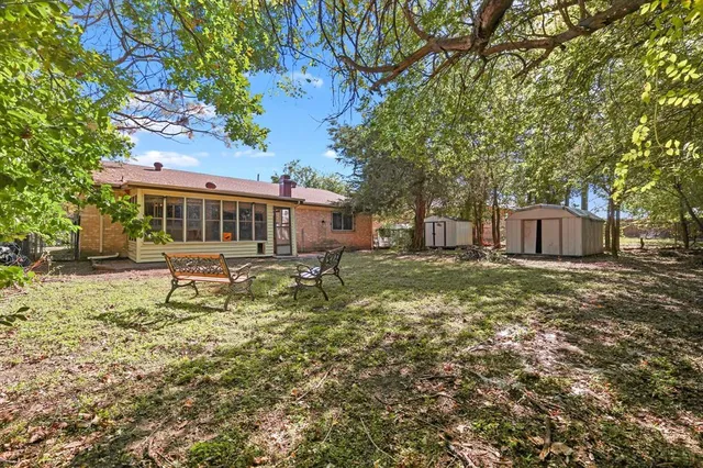 a view of a house with a garden