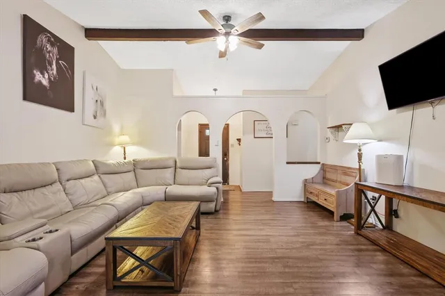 a kitchen with granite countertop a refrigerator stove and sink