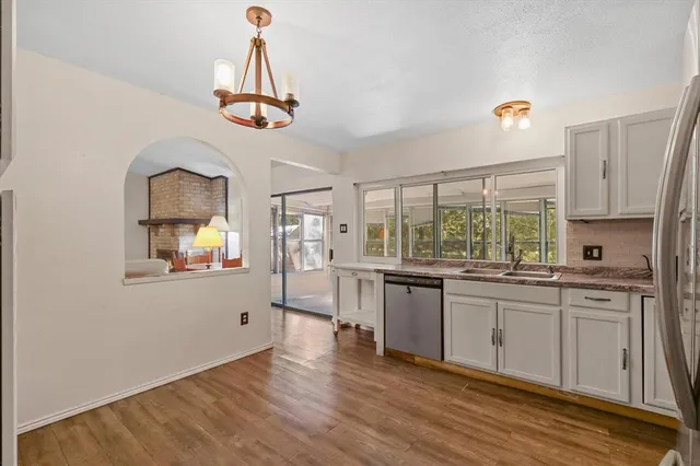 a bathroom with a toilet a sink and a mirror