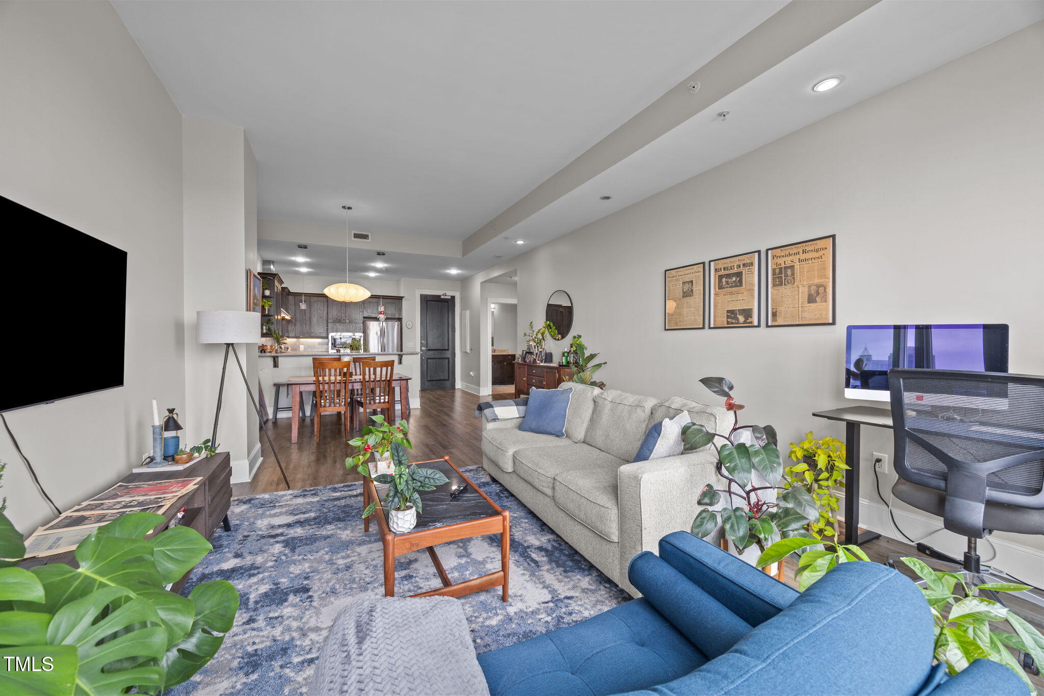 400 West North Street, Unit 1028 Raleigh, NC 27603 - Photo 27 of 30 a living room with furniture and a flat screen tv