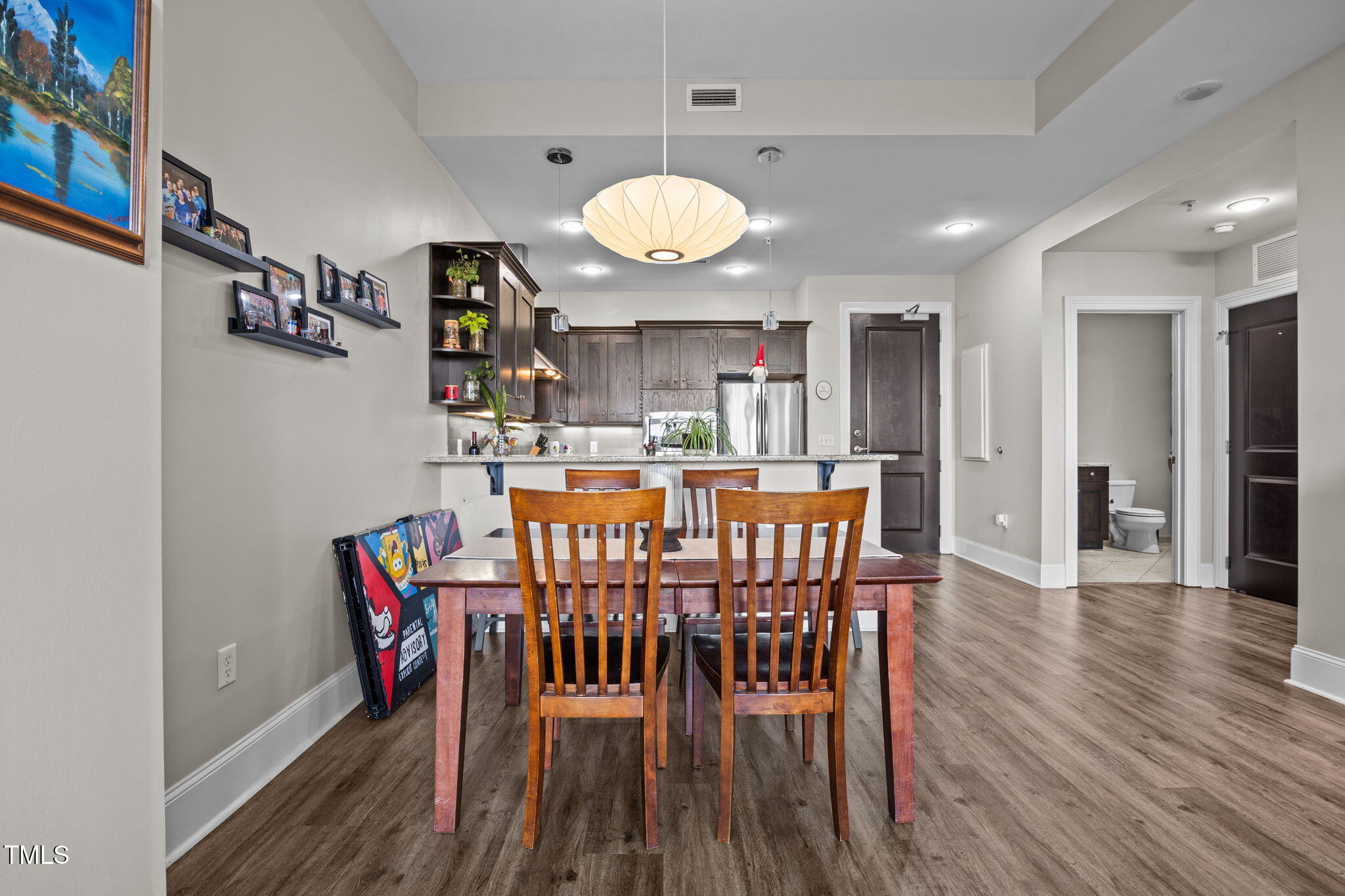 400 West North Street, Unit 1028 Raleigh, NC 27603 - Photo 8 of 30 a view of a dining room with furniture