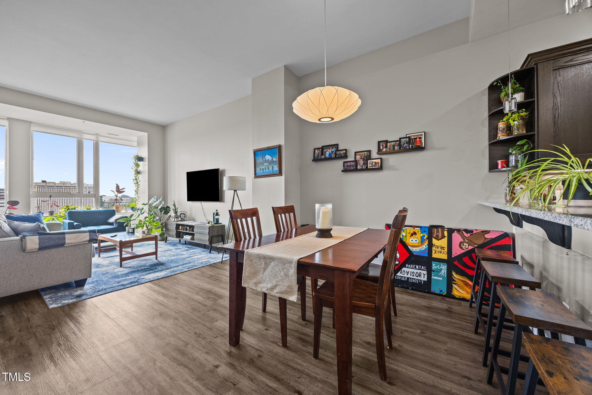 400 West North Street, Unit 1028 Raleigh, NC 27603 - Photo 9 of 30 a view of a dining room with furniture and wooden floor