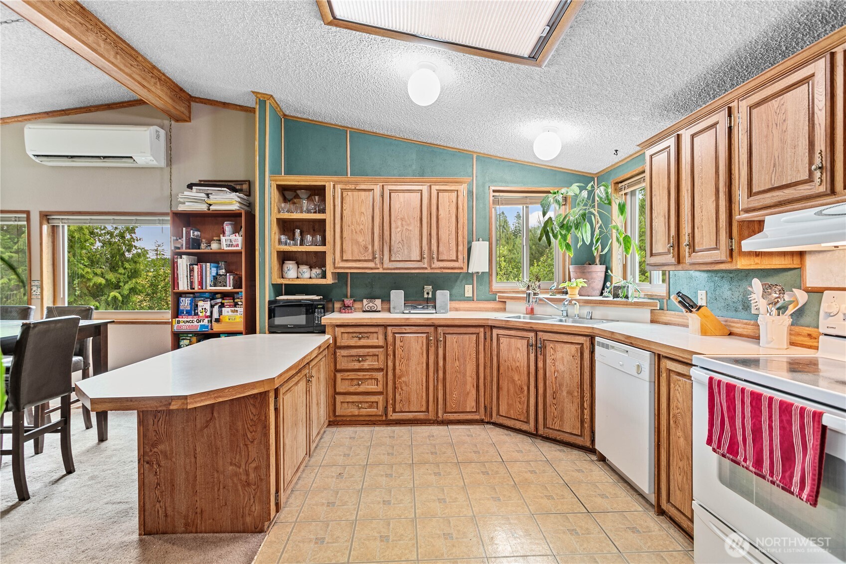 5459 Noon Road Bellingham, WA 98226 - Photo 12 of 40 a kitchen with stainless steel appliances granite countertop a stove and cabinets