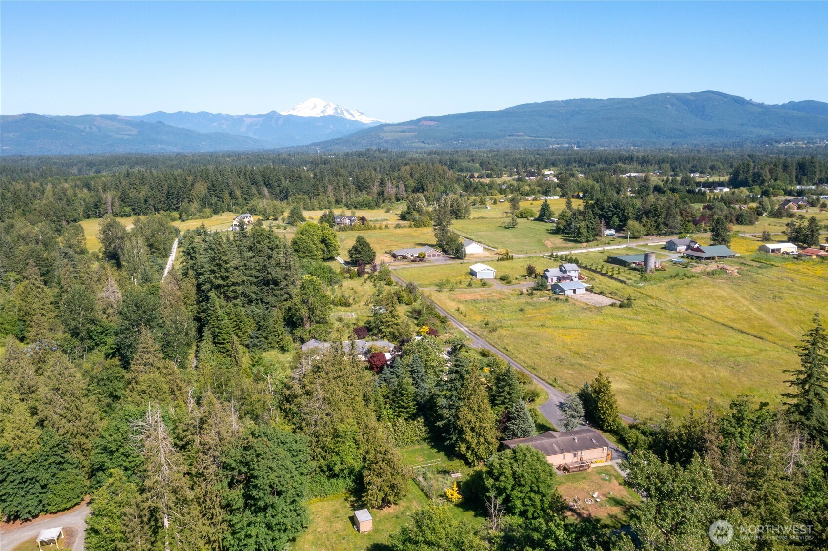 5459 Noon Road Bellingham, WA 98226 - Photo 36 of 40 a view of a city with mountains in the background
