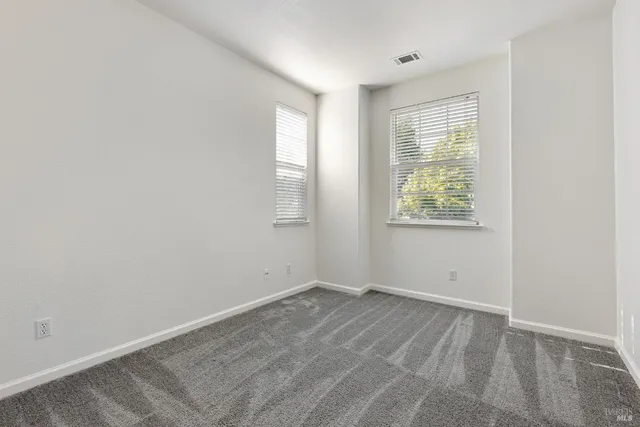 a backyard of a house with seating space