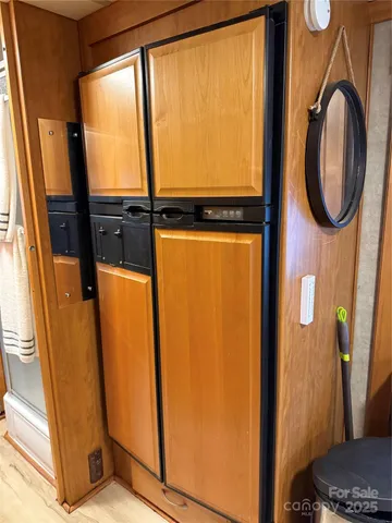a kitchen with granite countertop stainless steel appliances stove and cabinets