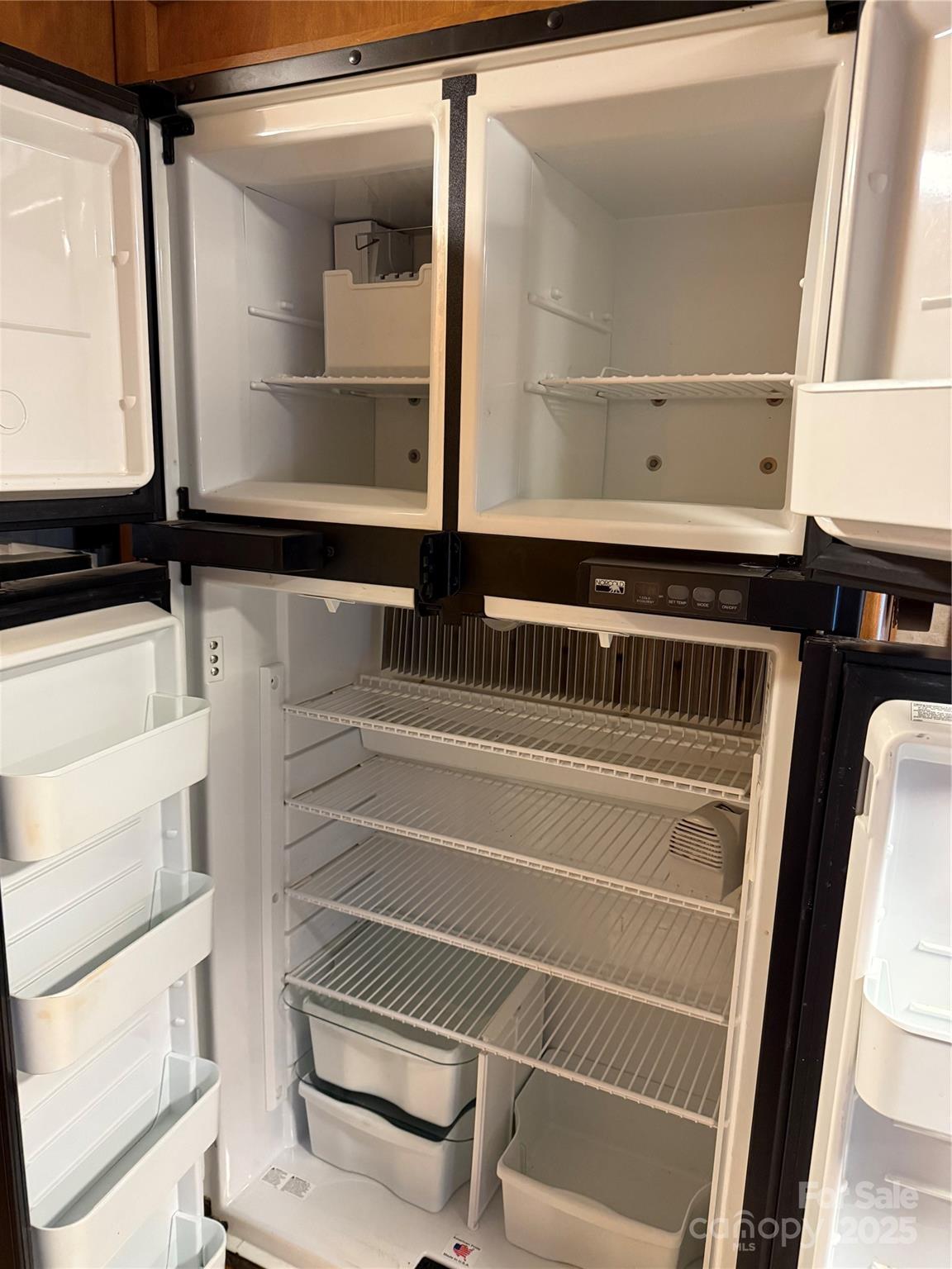 116 Muskhogean Way, Unit D74 Mount Gilead, NC 27306 - Photo 16 of 35 a view of walk in closet with clothes and window