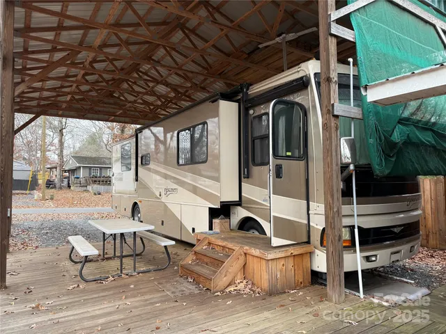 a view of a car park in front of a house