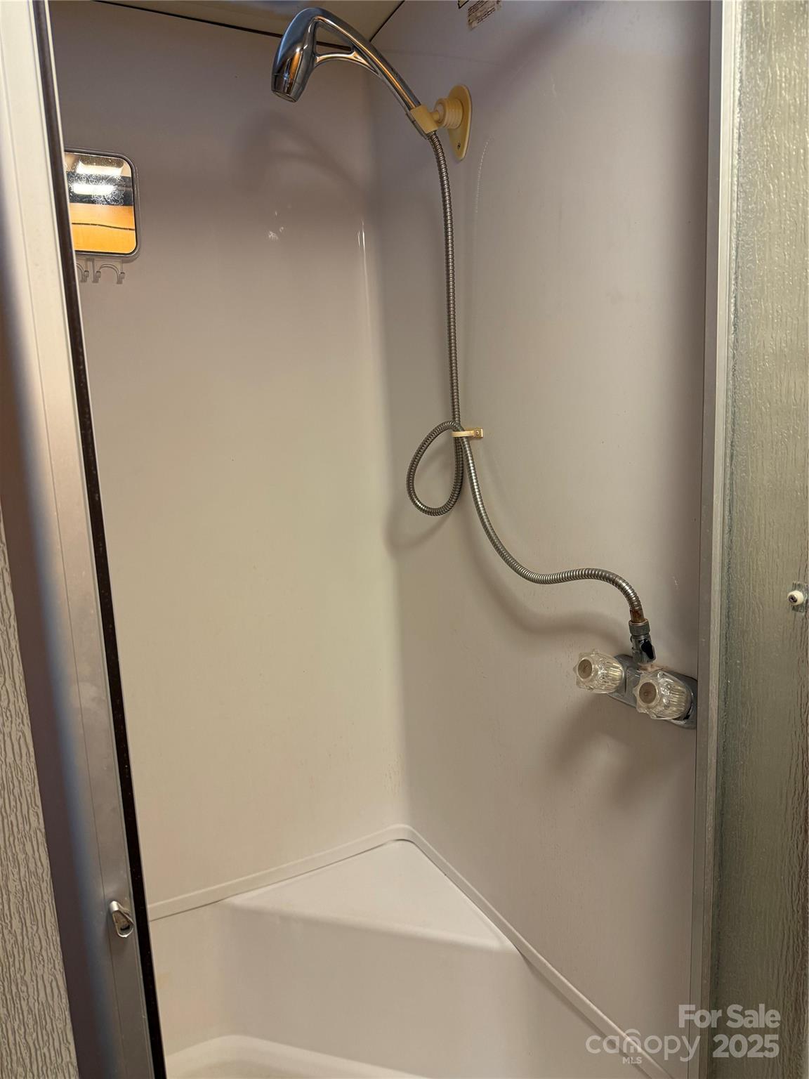 116 Muskhogean Way, Unit D74 Mount Gilead, NC 27306 - Photo 26 of 35 a bathroom with a shower