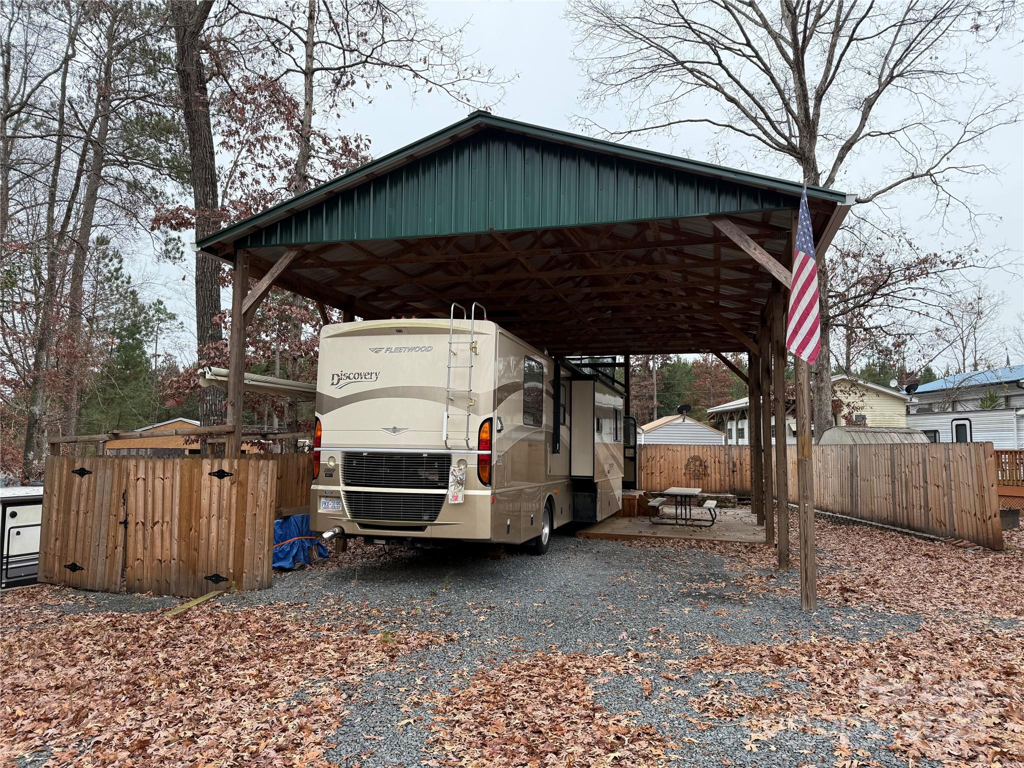 116 Muskhogean Way, Unit D74 Mount Gilead, NC 27306 - Photo 3 of 35 a view of a car park in front of a house