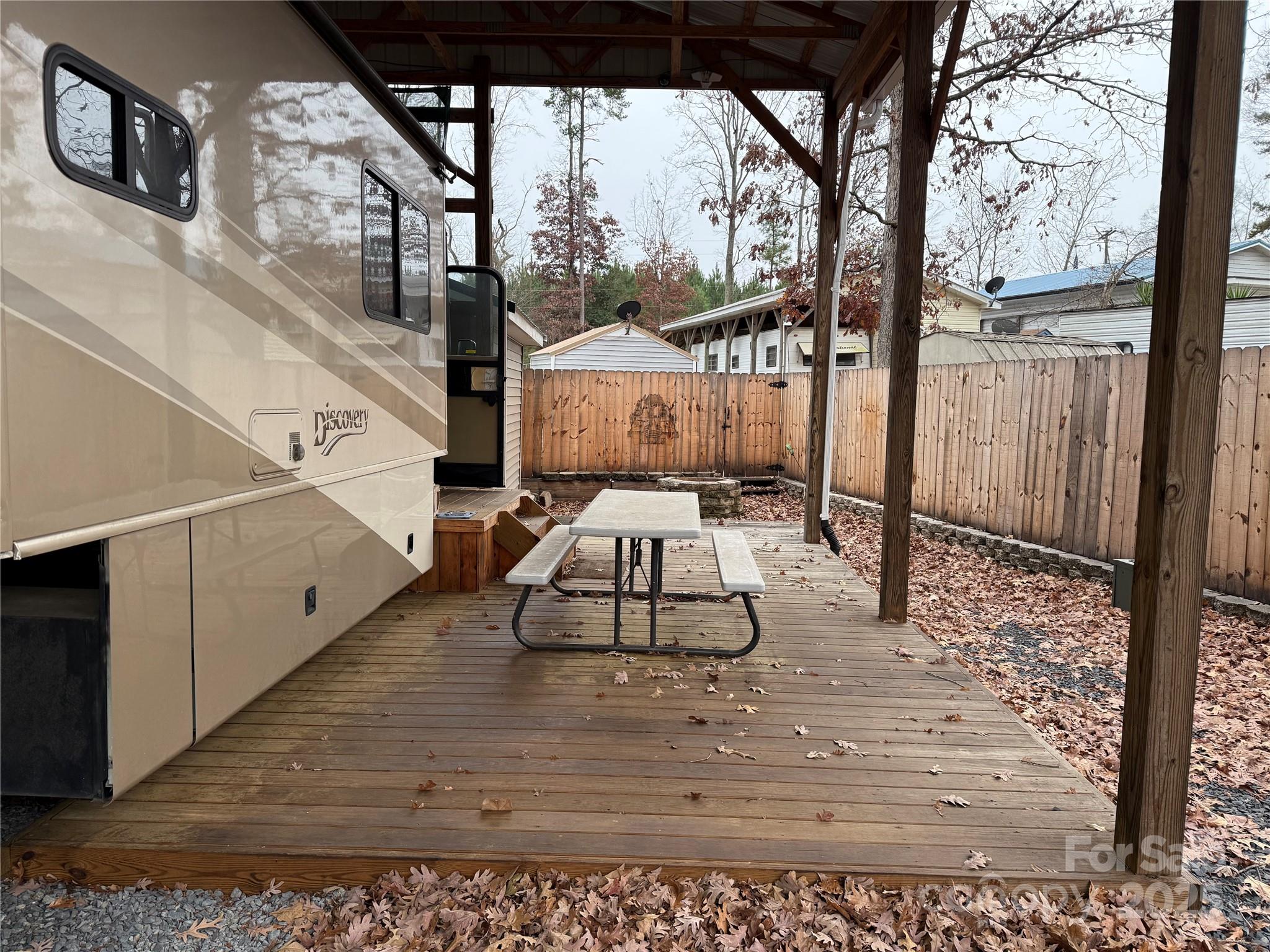 116 Muskhogean Way, Unit D74 Mount Gilead, NC 27306 - Photo 6 of 35 a view of a porch with a floor to ceiling window