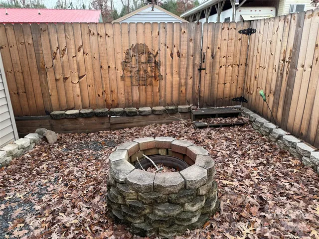 a view of a patio with a table and chairs