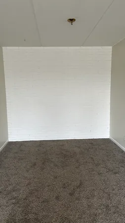 a white toilet sitting next to a bath tub