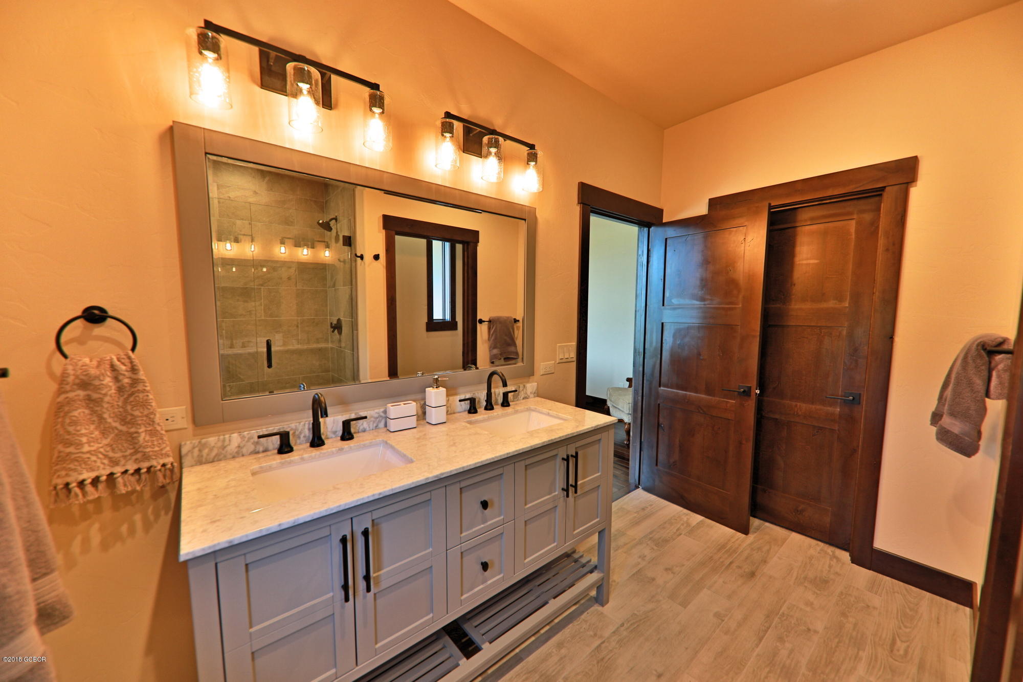315 Porcupine Ridge Road Fraser, CO 80442 - Photo 11 of 15 a bathroom with a double vanity sink and mirror