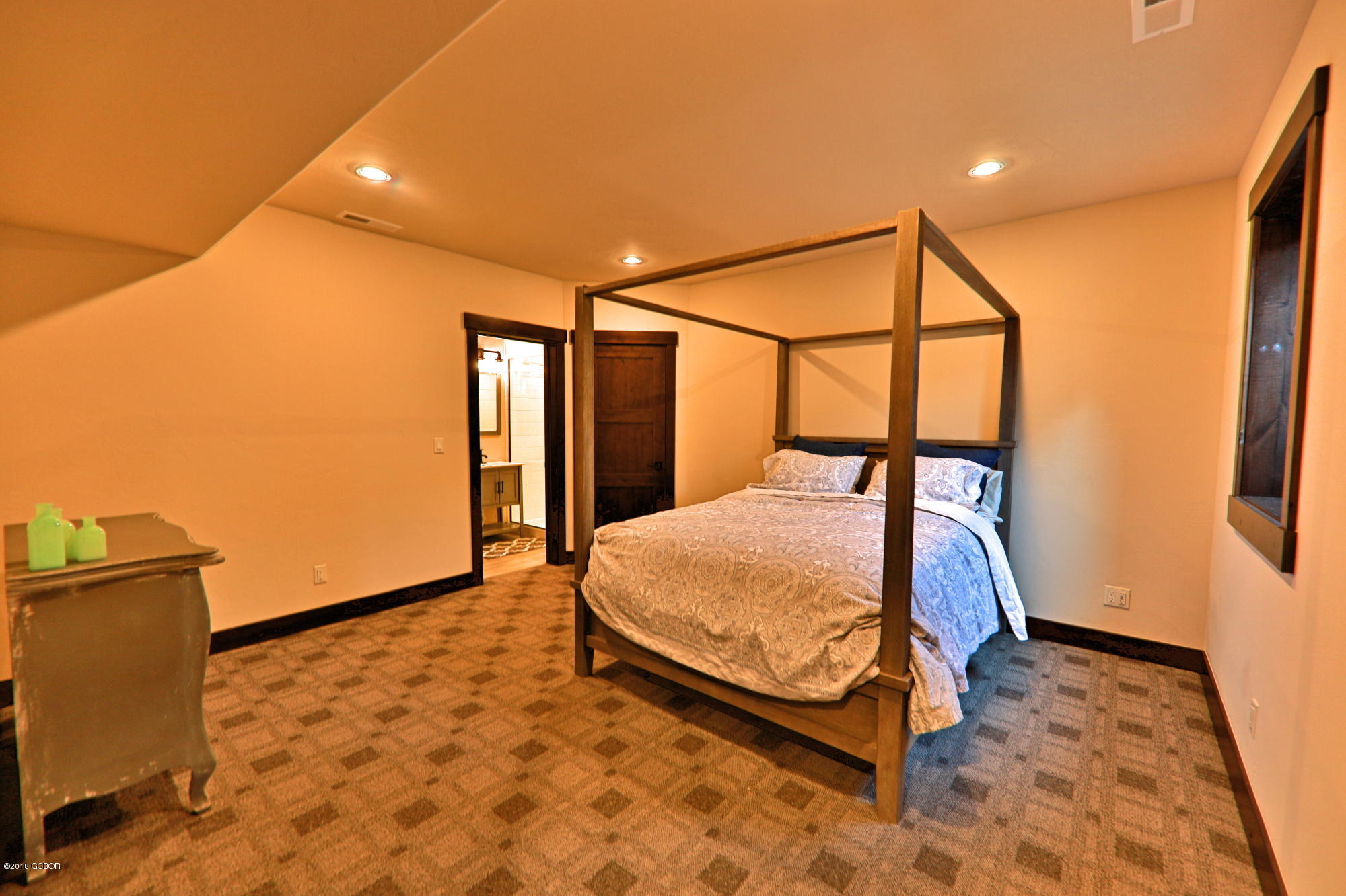 315 Porcupine Ridge Road Fraser, CO 80442 - Photo 12 of 15 a bedroom with a bed and wooden floor