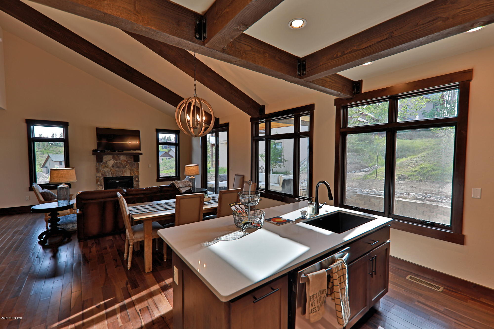 315 Porcupine Ridge Road Fraser, CO 80442 - Photo 5 of 15 a view of a dining room with furniture window and wooden floor