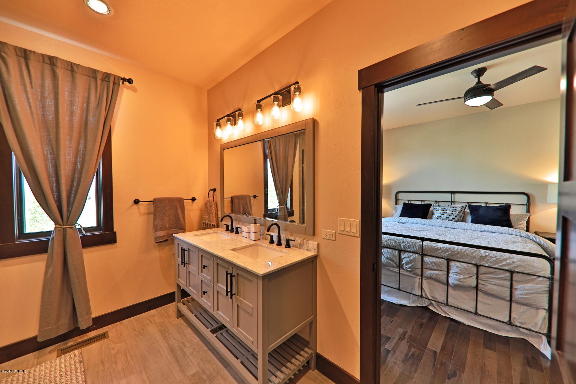 315 Porcupine Ridge Road Fraser, CO 80442 - Photo 10 of 15 a en suite bathroom with a sink a mirror and a shower