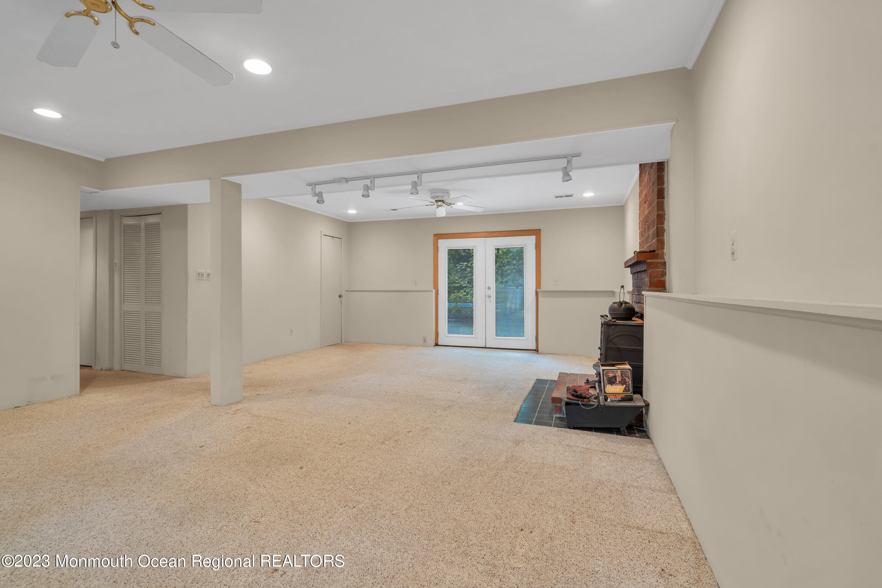 74 Willow Drive Jackson, NJ 08527 - Photo 13 of 20 a view of a room with gym equipment and a large window