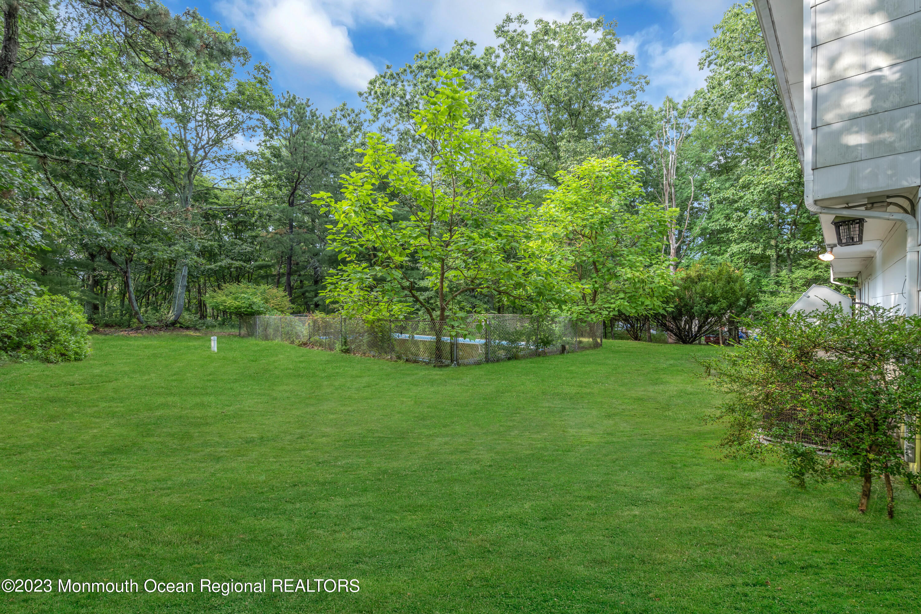 74 Willow Drive Jackson, NJ 08527 - Photo 18 of 20 a view of a green field with plants