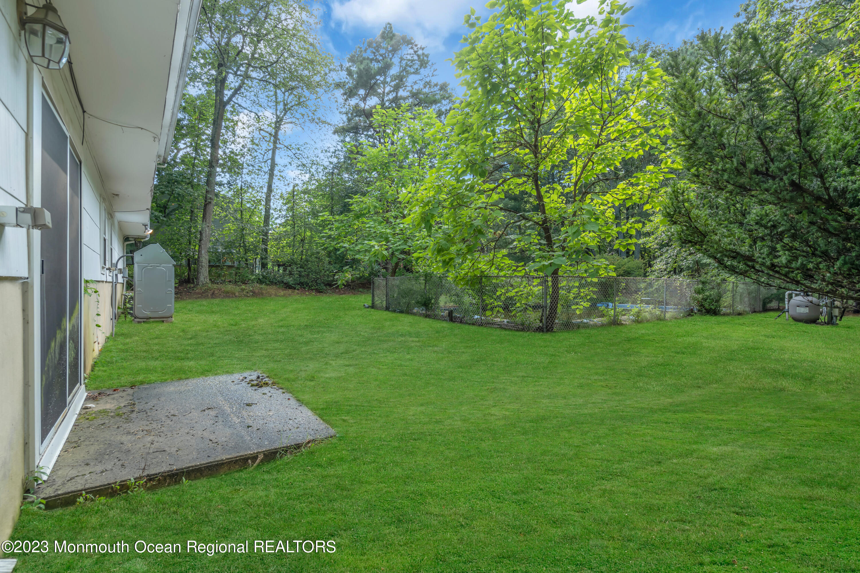 74 Willow Drive Jackson, NJ 08527 - Photo 19 of 20 a view of a backyard with a garden
